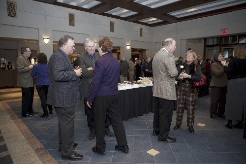 Faculty and staff enjoy the reception